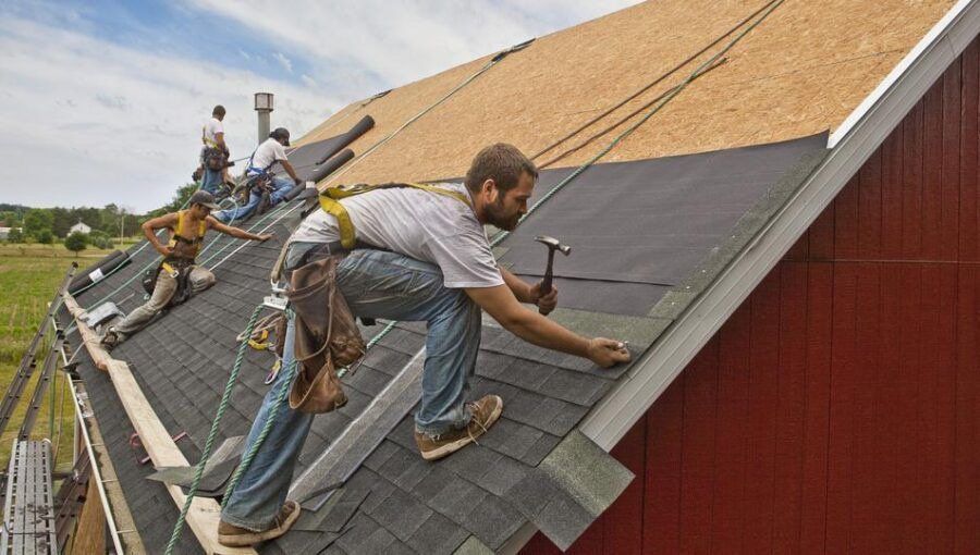 Men repairing roof
