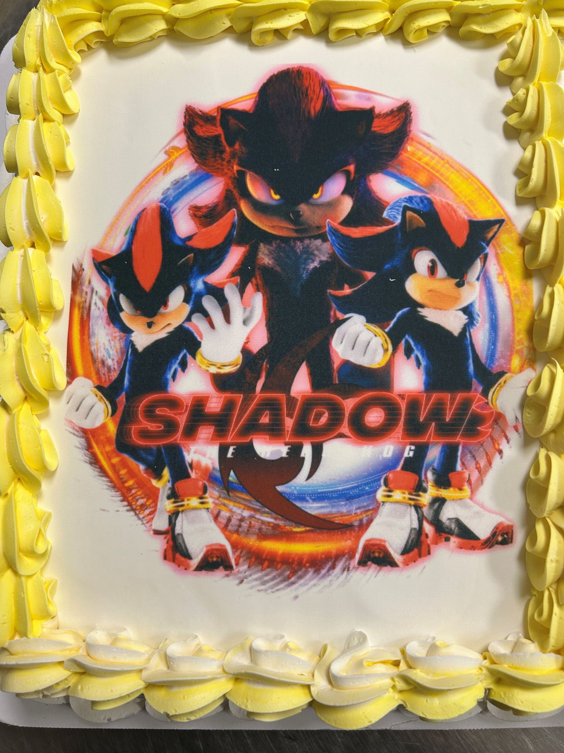 A shadow the hedgehog cake with yellow frosting