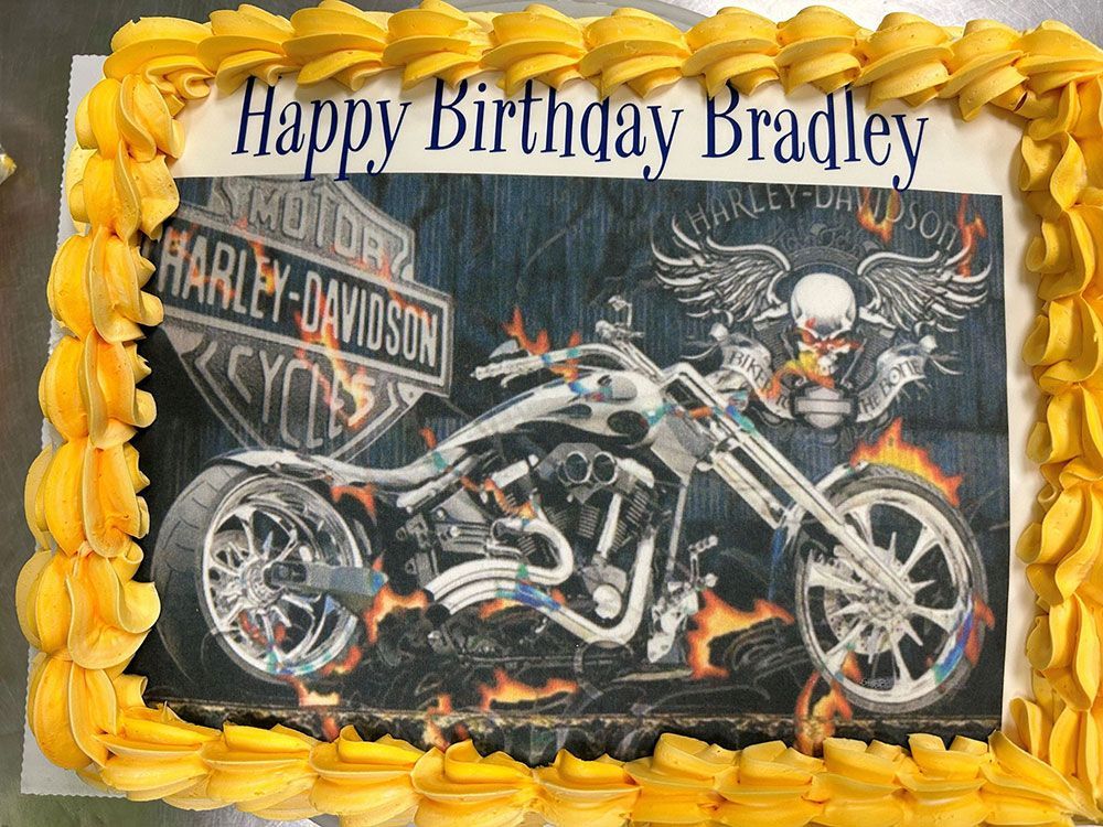 A birthday cake with a picture of a harley davidson motorcycle on it
