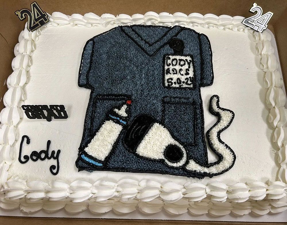 A cake with a picture of a scrub top on it.