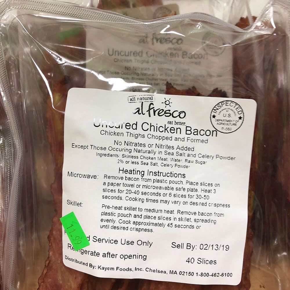 A package of alfresco uncured chicken bacon with instructions