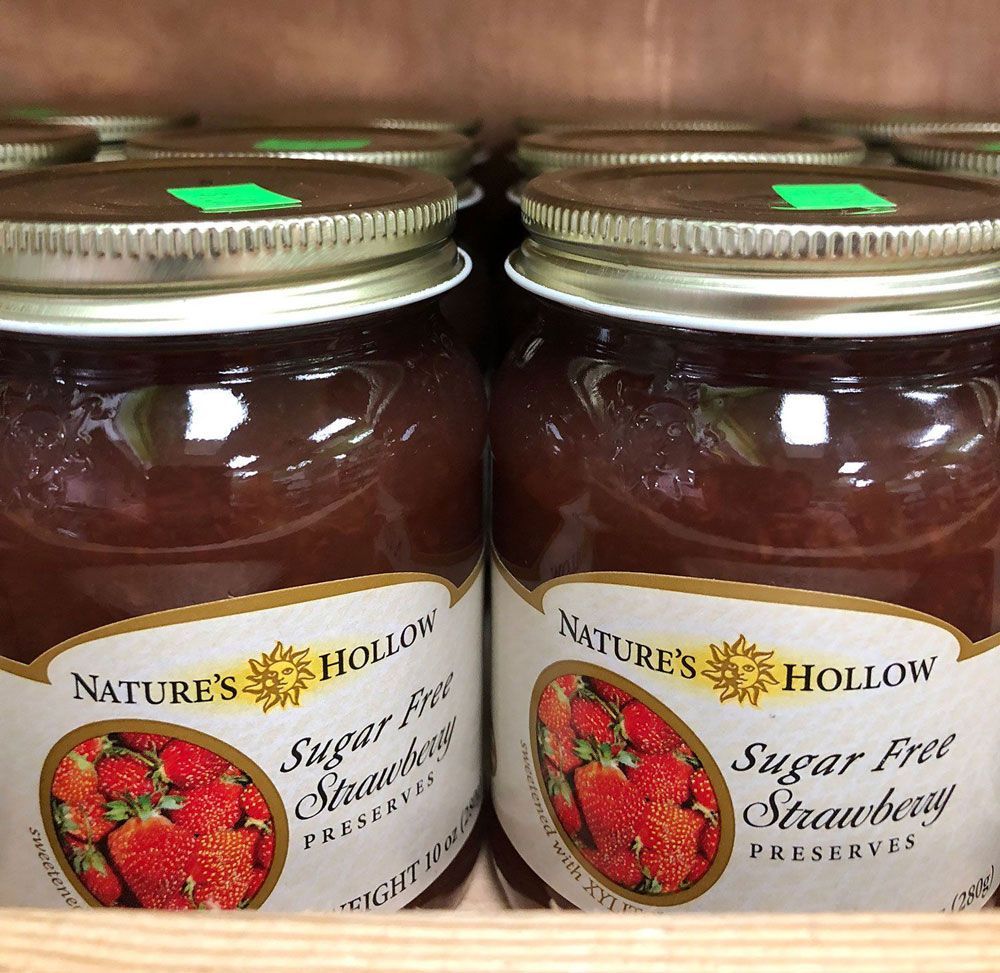Two jars of nature 's hollow sugar free strawberry preserves