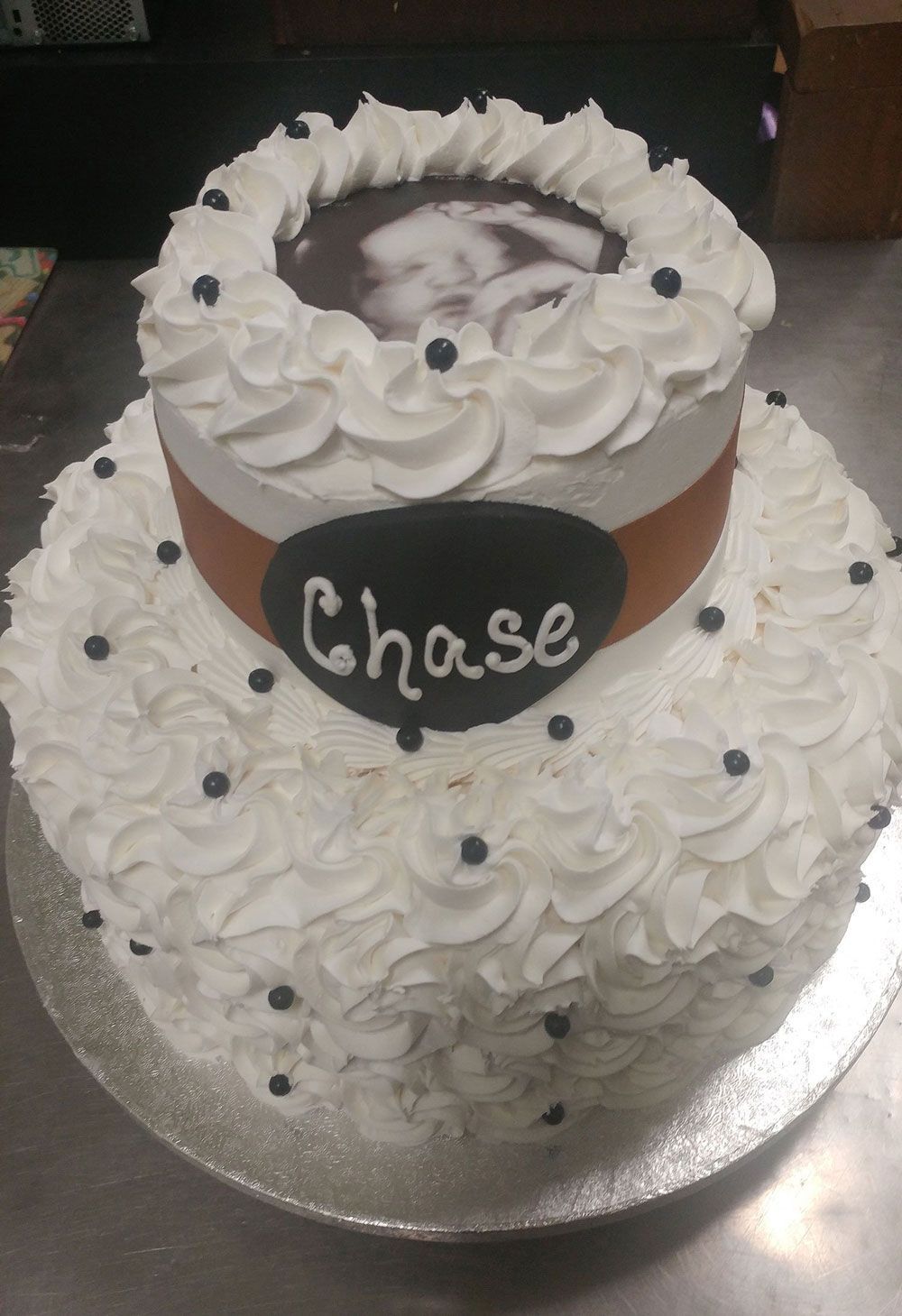 A white cake with the name chase on it