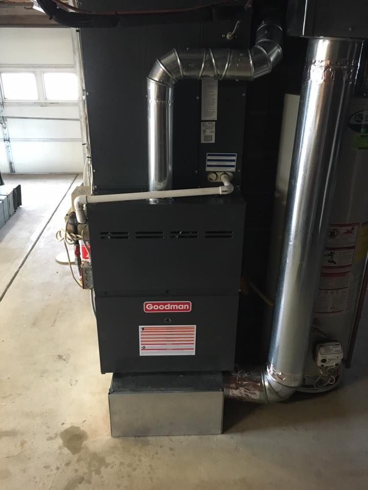 A heating and cooling system is installed in a garage.
