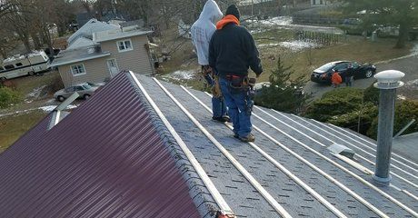workers fixing roof