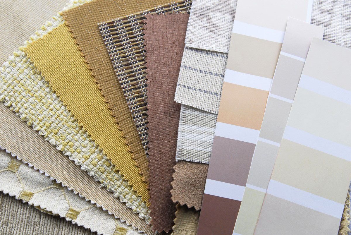 Fabric swatches and paint color strips in neutral shades.