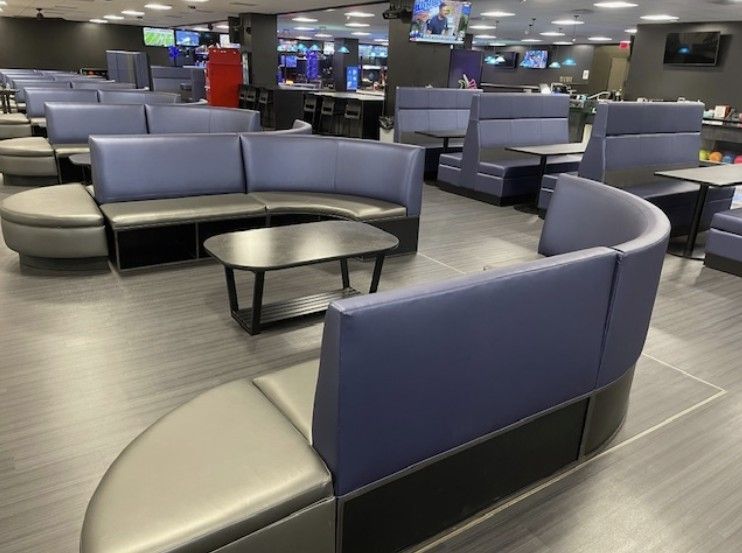 Blue bowling alley booths and seating
