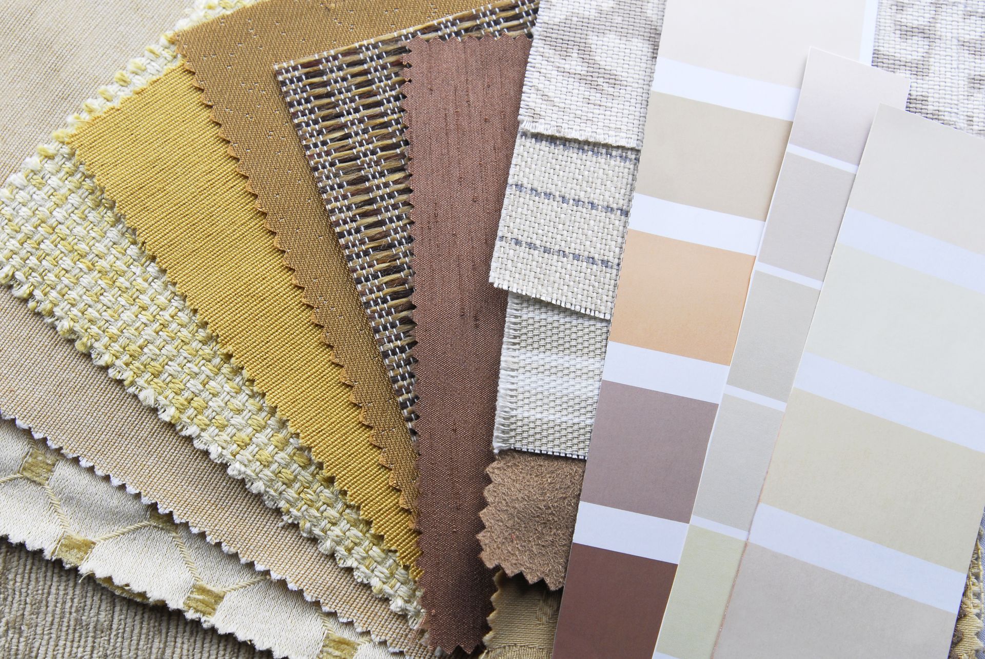 Fabric swatches and paint color strips in neutral shades.
