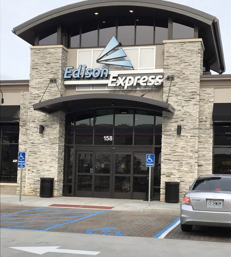 Entrance to Edison Express building with accessible parking spots.