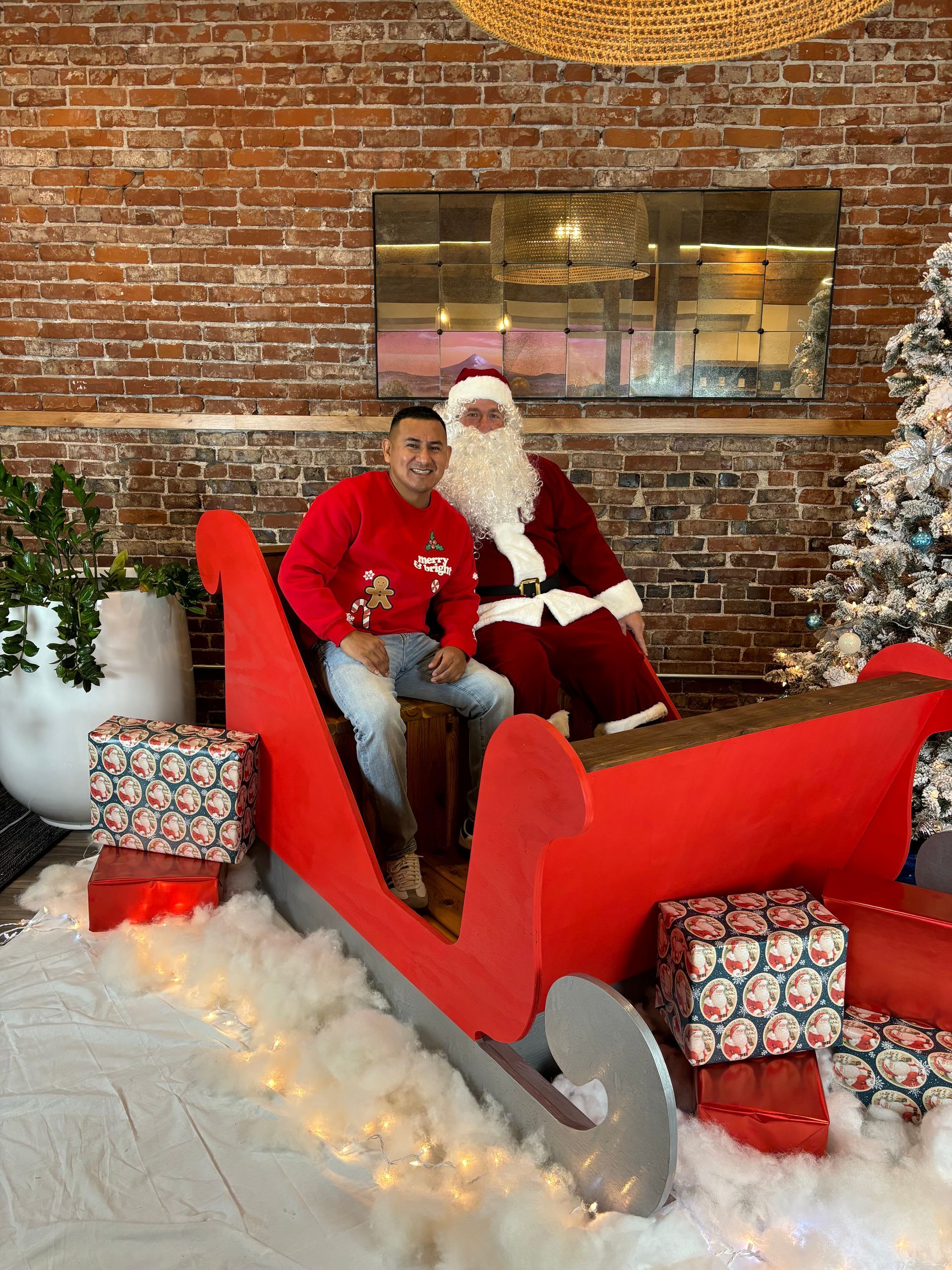 Man and Santa in a sleigh