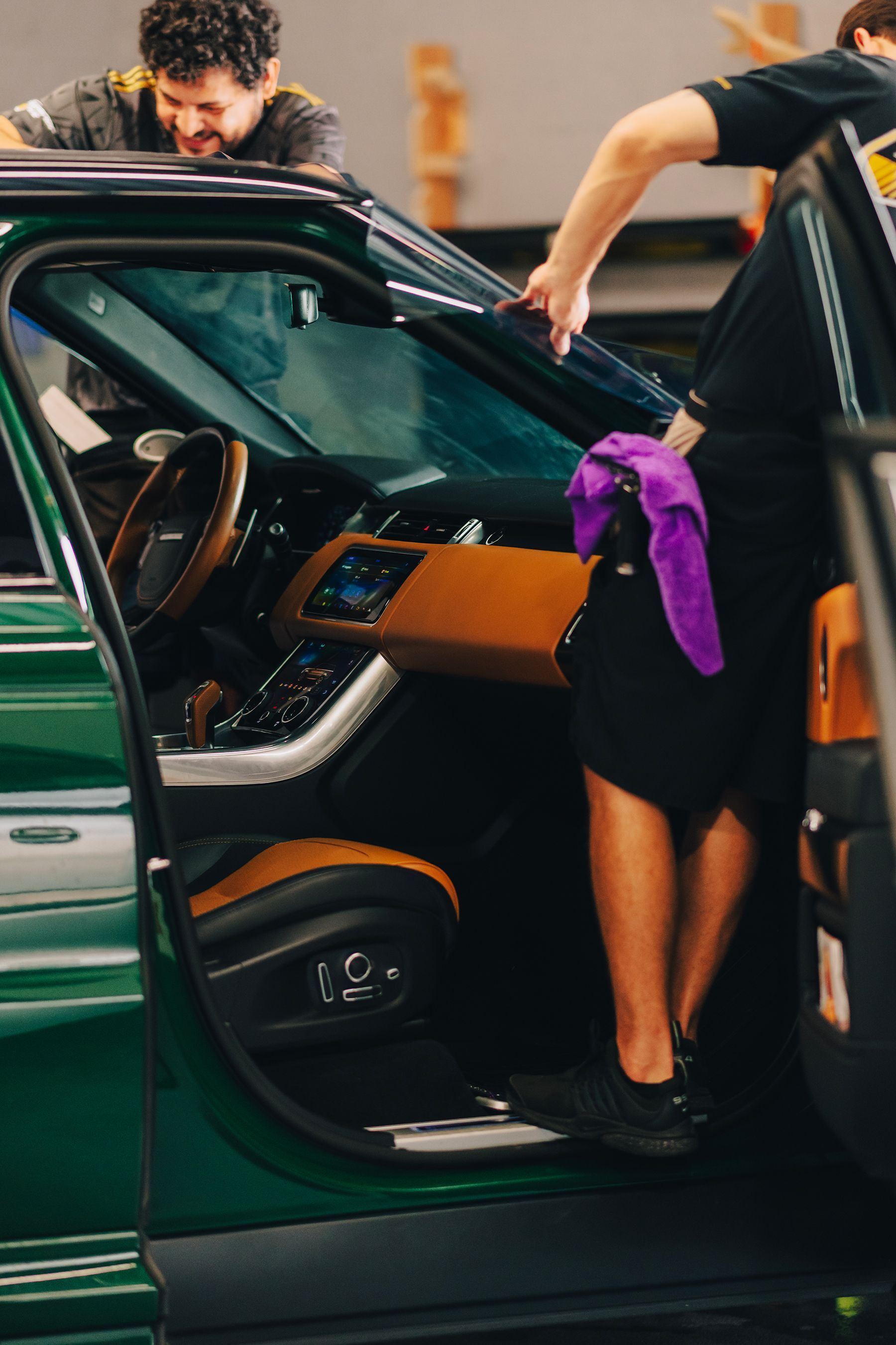 Canvas prints of cars leaning against a wall with hexagonal glowing lights. Copper wire visible.