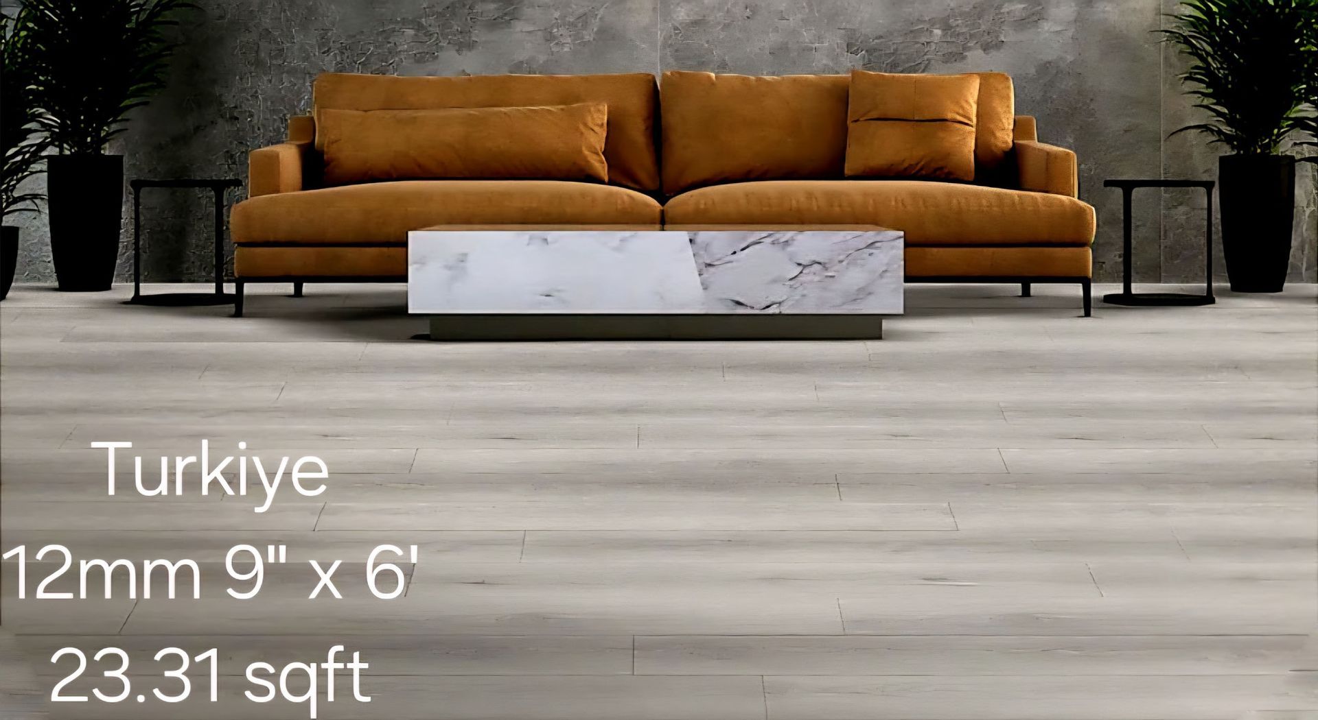 Living room with light-colored flooring, brown sofa, marble coffee table, side tables, and plants. Text: Turkiye, 12mm 9