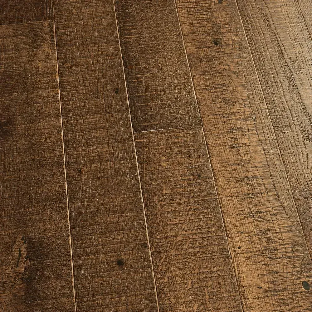 A close up of a wooden floor with a grainy texture.