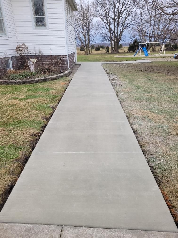 a concrete walkway project with play area