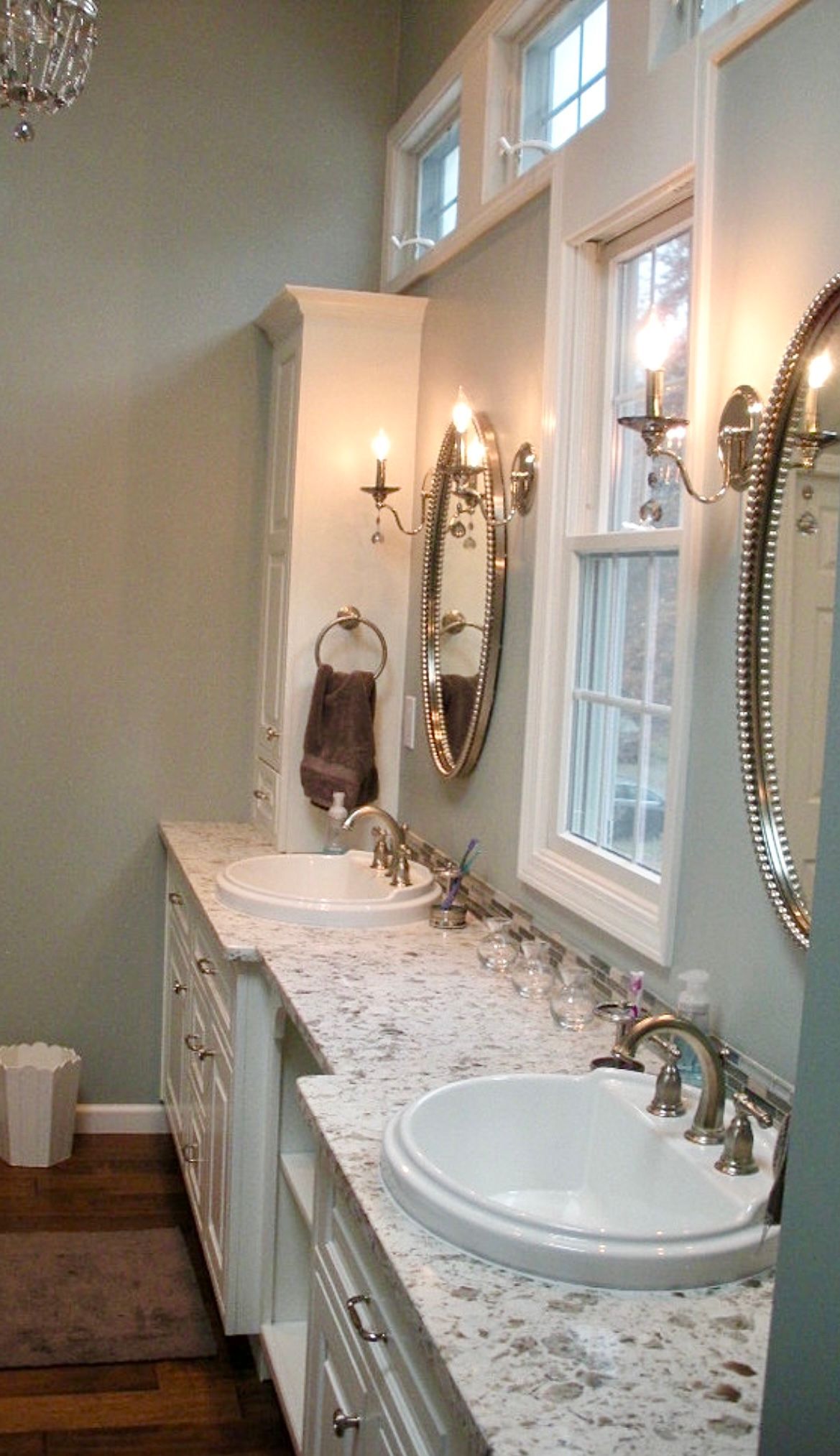 A bathroom with two sinks and two mirrors
