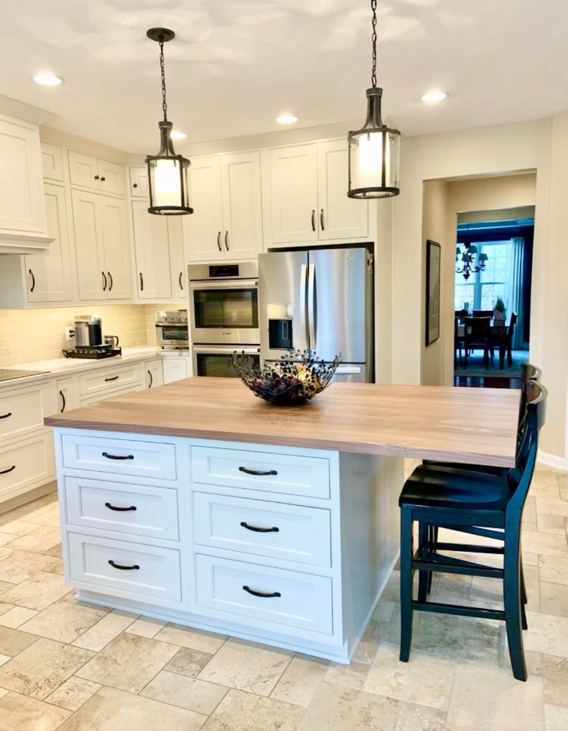 There is a large island in the middle of the kitchen.