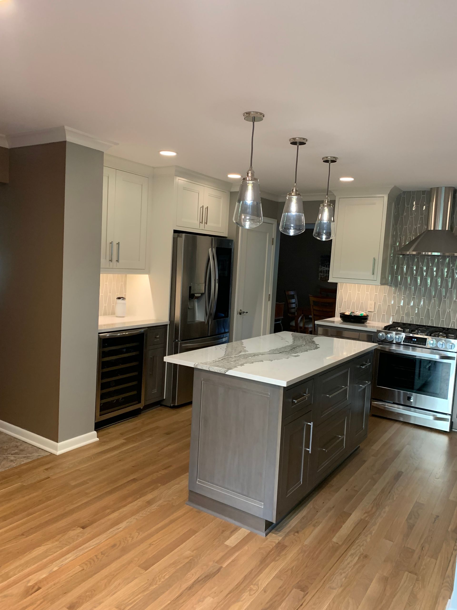 A kitchen with a large island in the middle of the room.