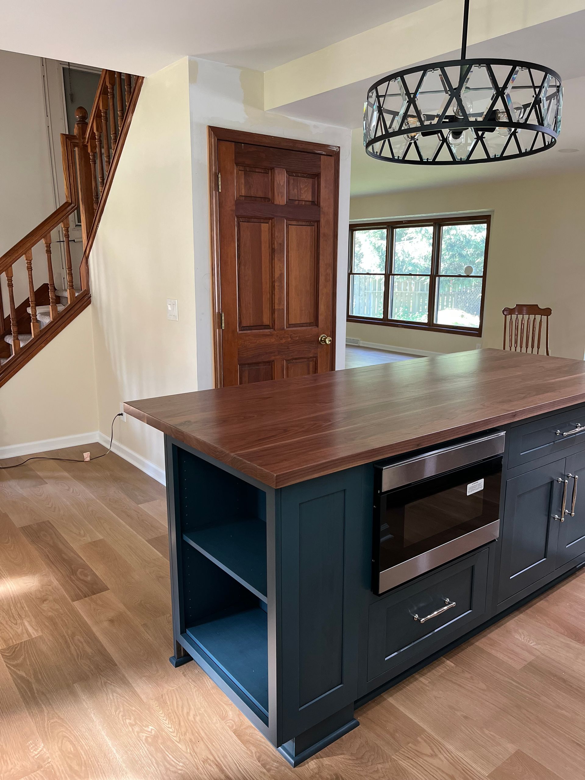 A kitchen with a large island in the middle of the room.