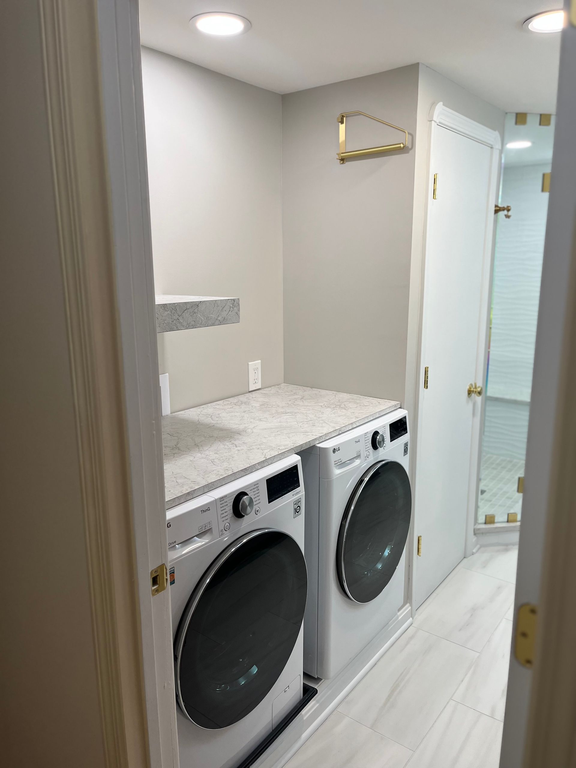 A laundry room with a washer and dryer in it