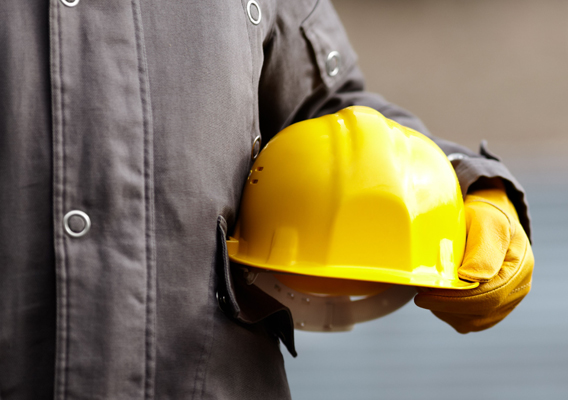 Construction worker holding hard-hat