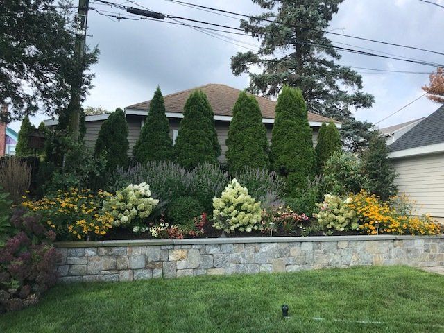 Retaining wall - with trees and flowers on top