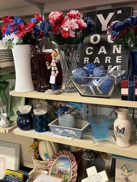 A shelf with a sign that says