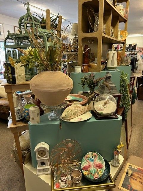 A store filled with lots of items including vases and clocks.