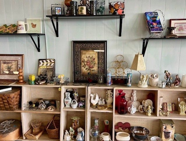 A room filled with shelves filled with lots of objects.