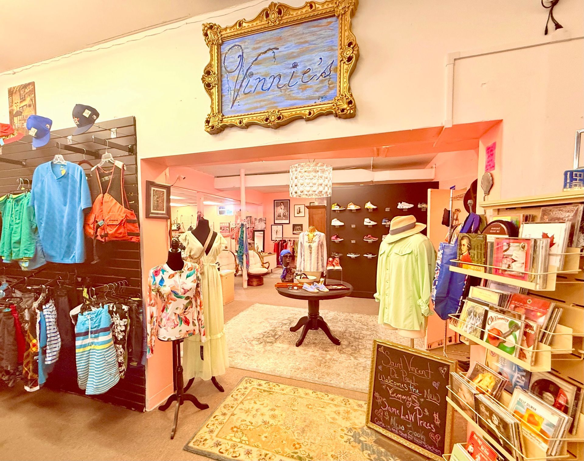 A store filled with clothes and a painting on the wall