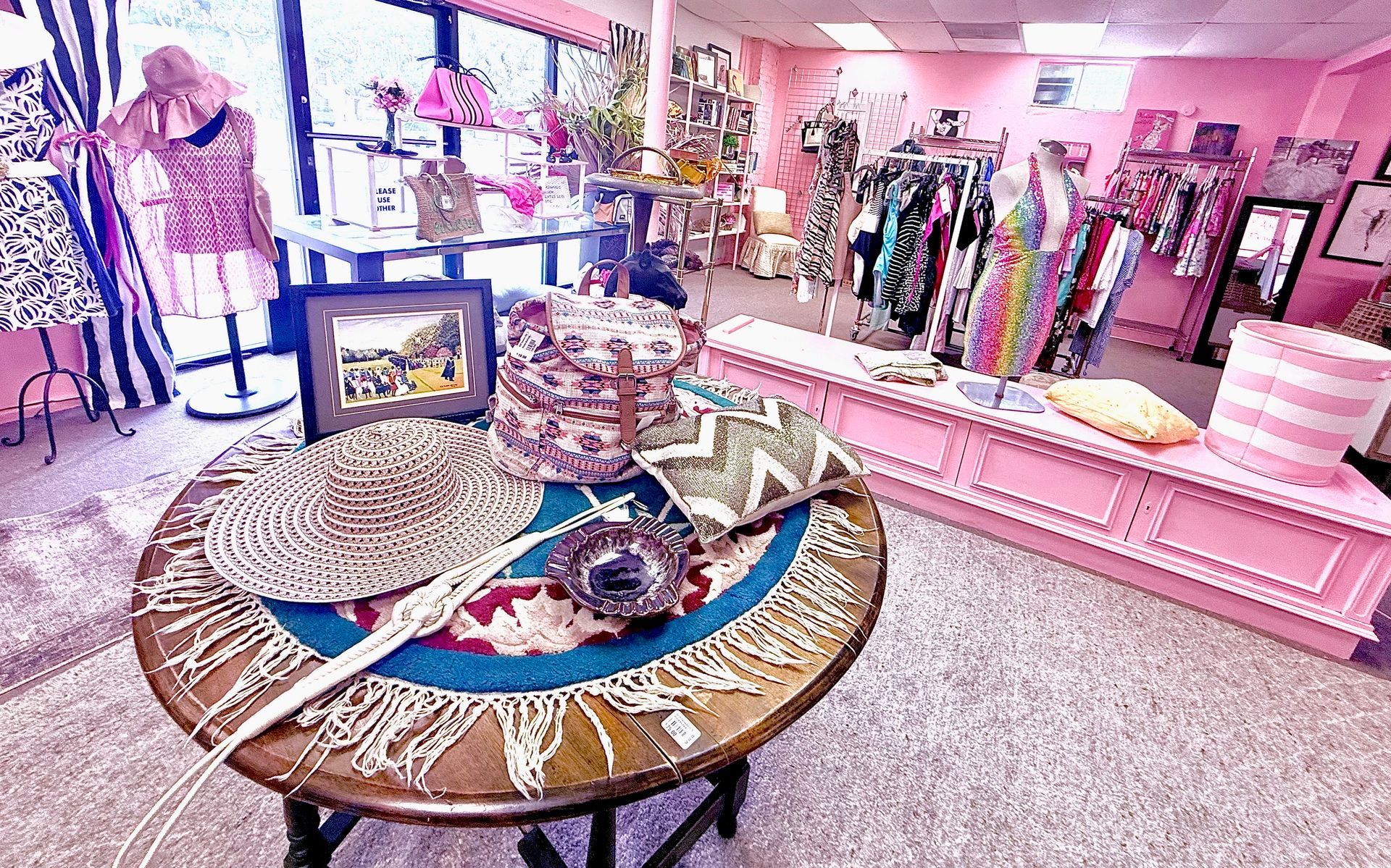 There is a table in the middle of the room in a store