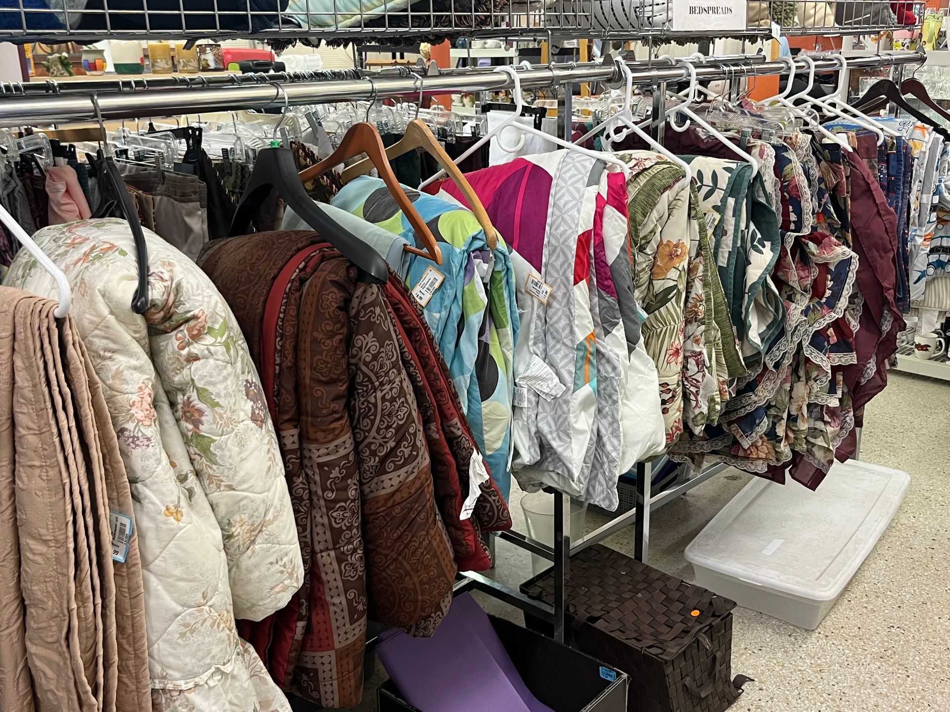 A row of clothes hanging on a rack in a store