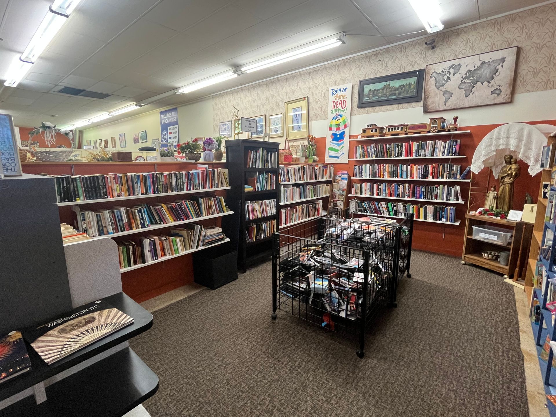 A bookstore filled with lots of books and a table