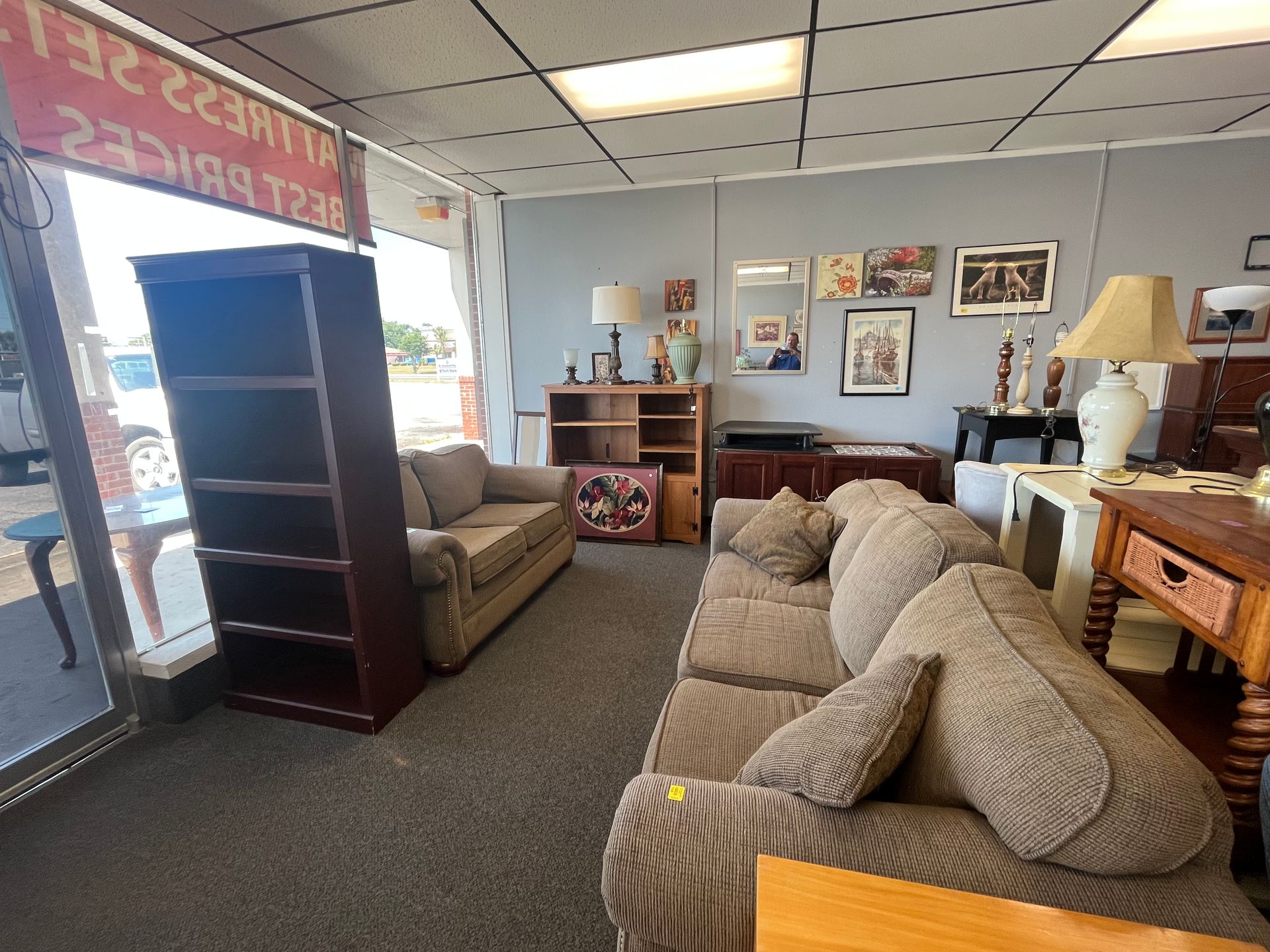 A living room with a couch and a bookshelf