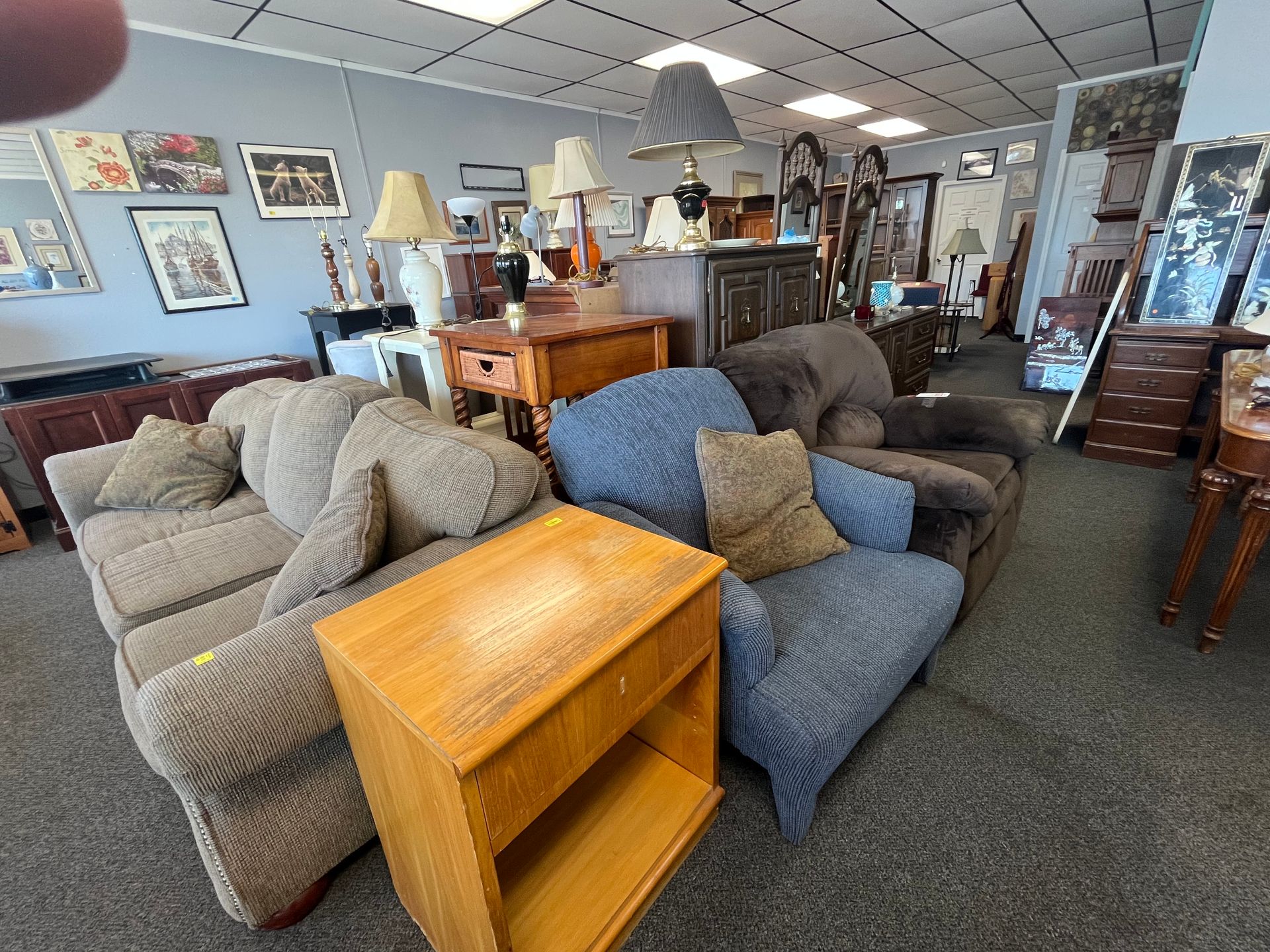A room filled with furniture and lamps in a store