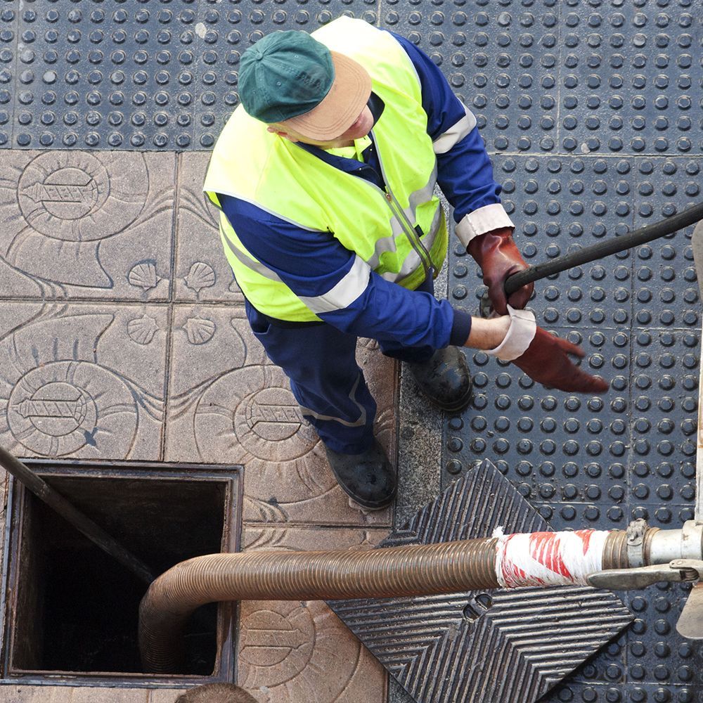 A man is working on a pipe