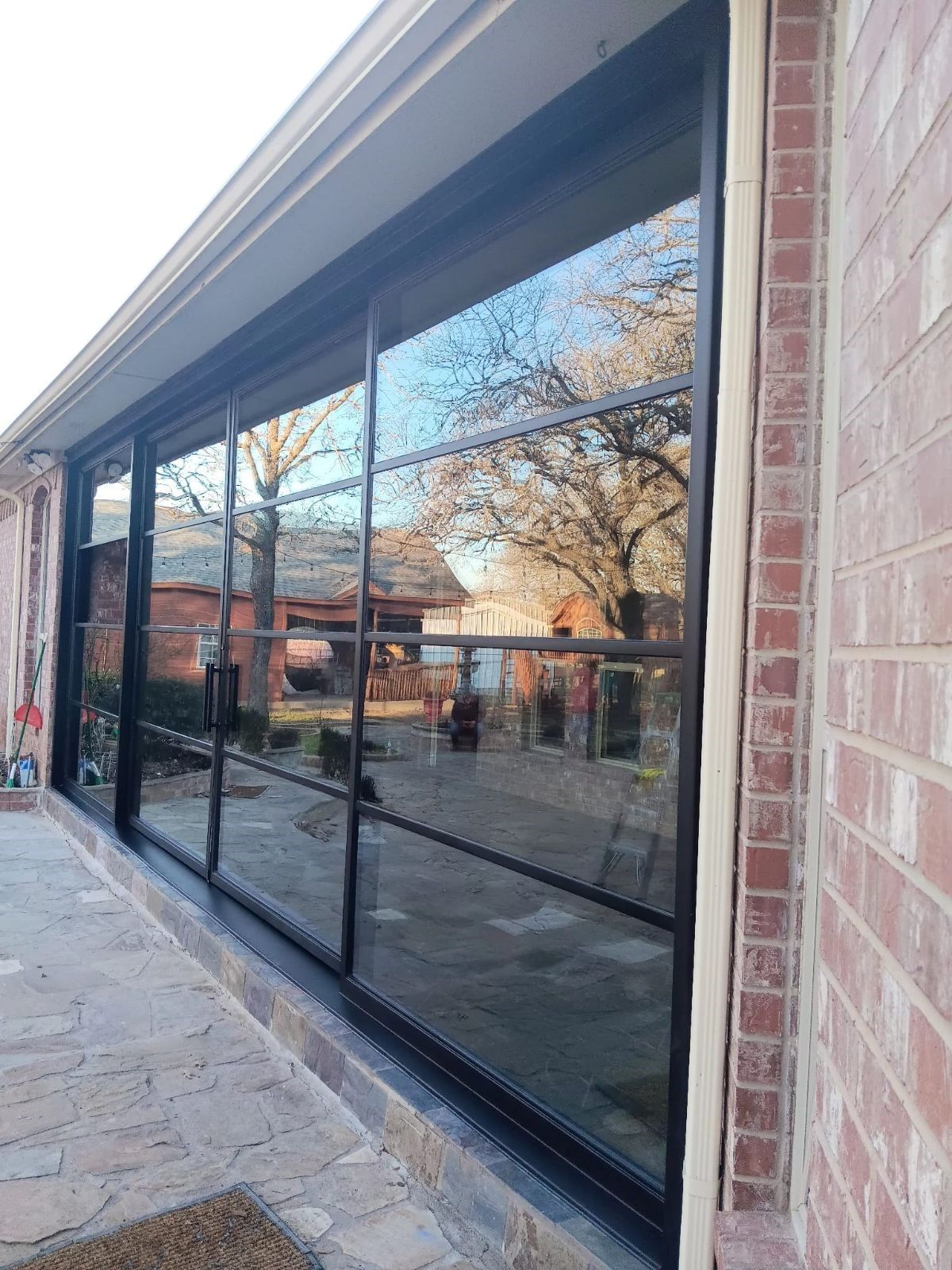 A large window on the side of a brick building