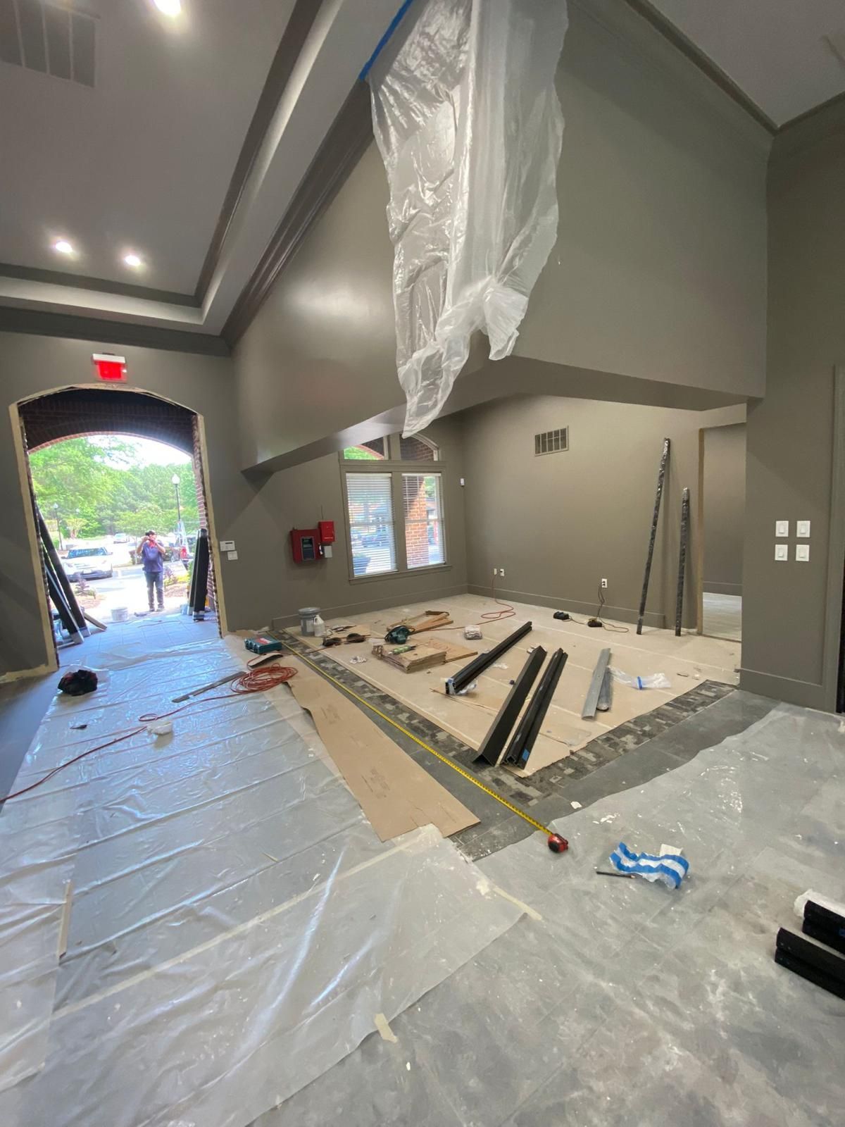 A large room with a lot of plastic covering the floor and walls.