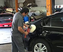 man buffing the car