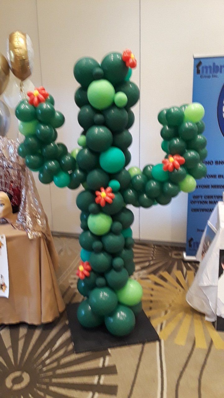A cactus made out of balloons in a room