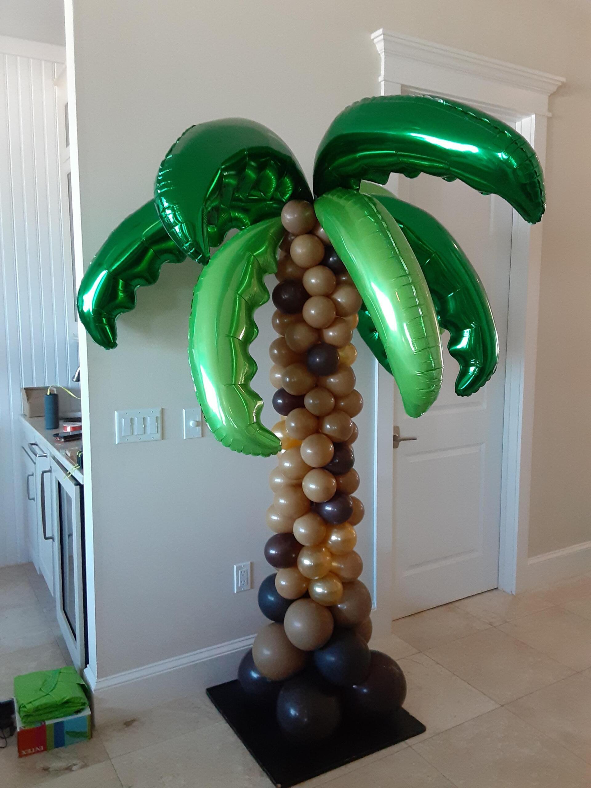 A palm tree made of balloons in a room