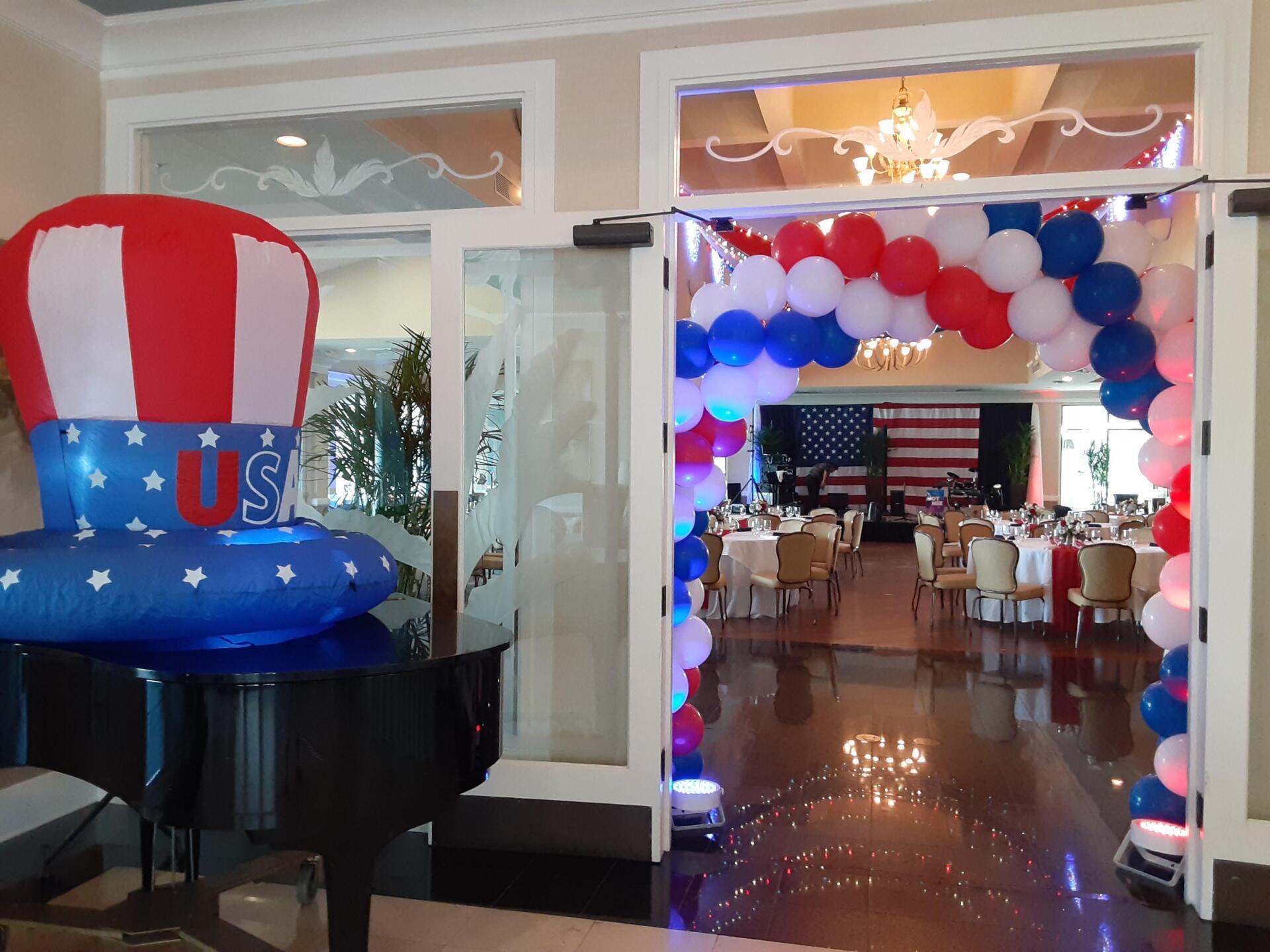 A room filled with balloons and a hot air balloon with the word usa on it.