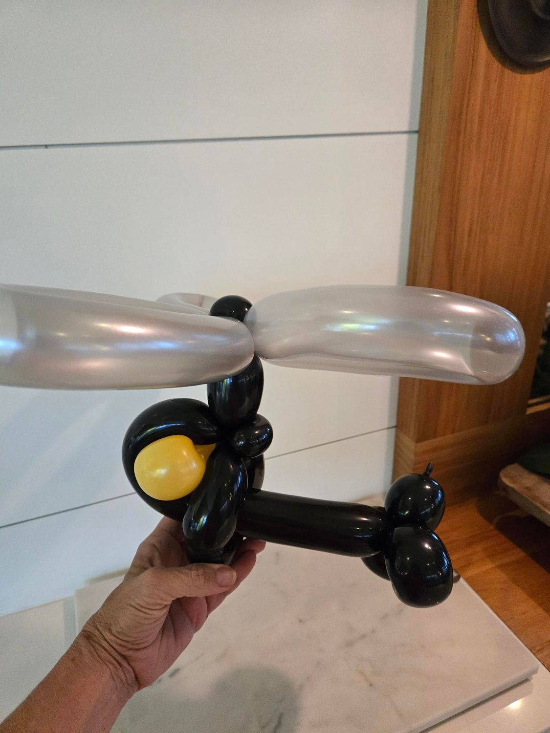 Black balloon helicopter with silver blades