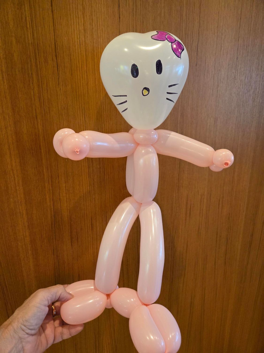 Balloon sculpture of Hello Kitty with pink body