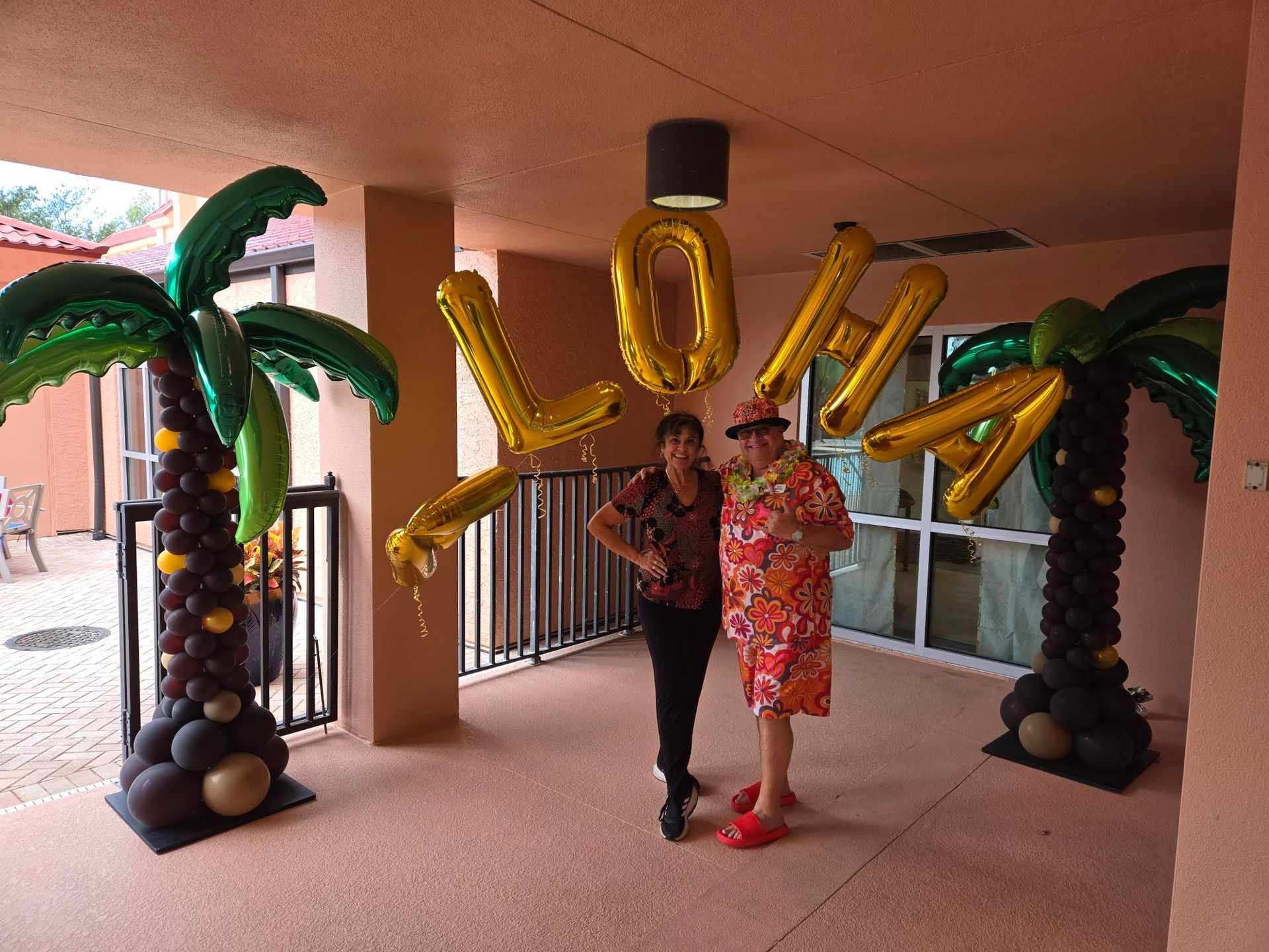 Two people pose with gold 