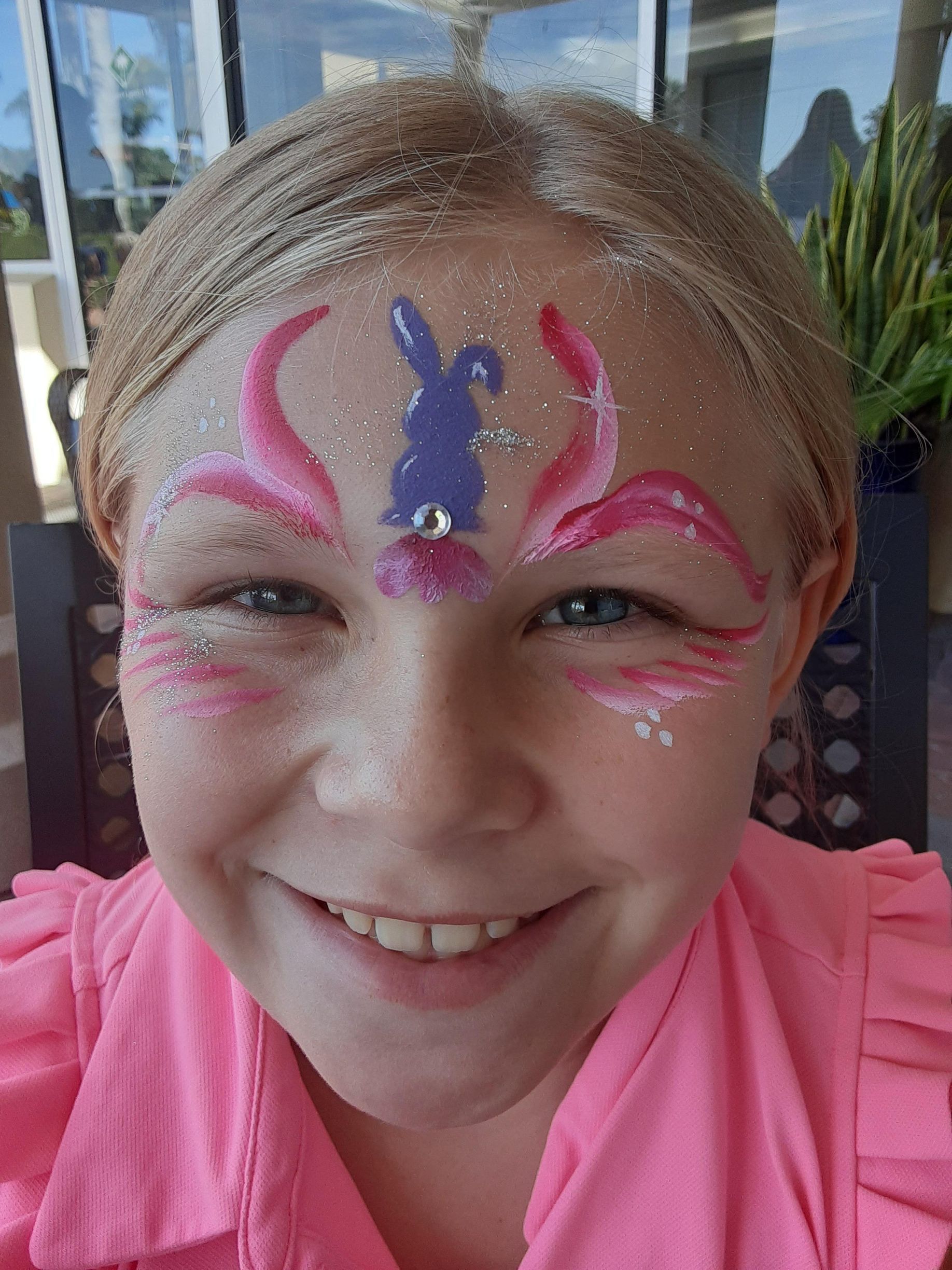 Girl with pink face paint