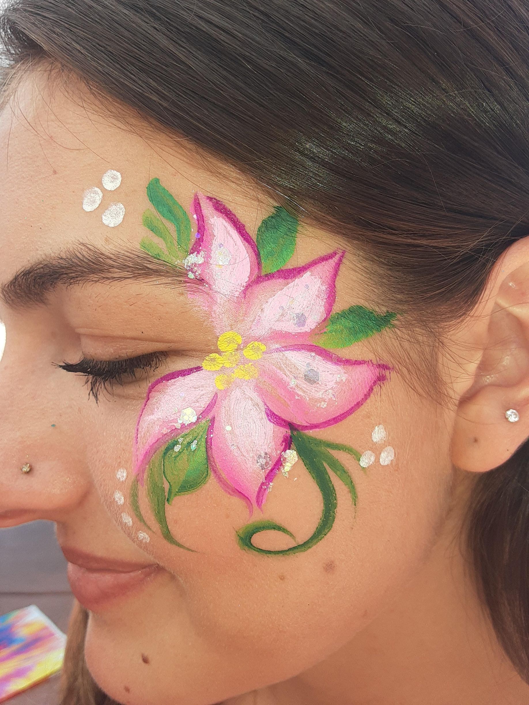 Woman with pink flower face paint