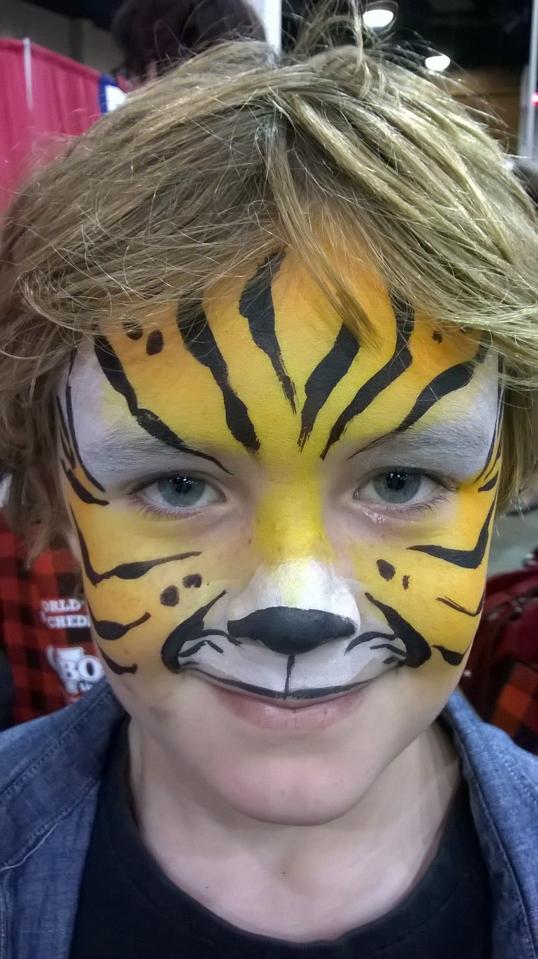 Child with tiger face paint