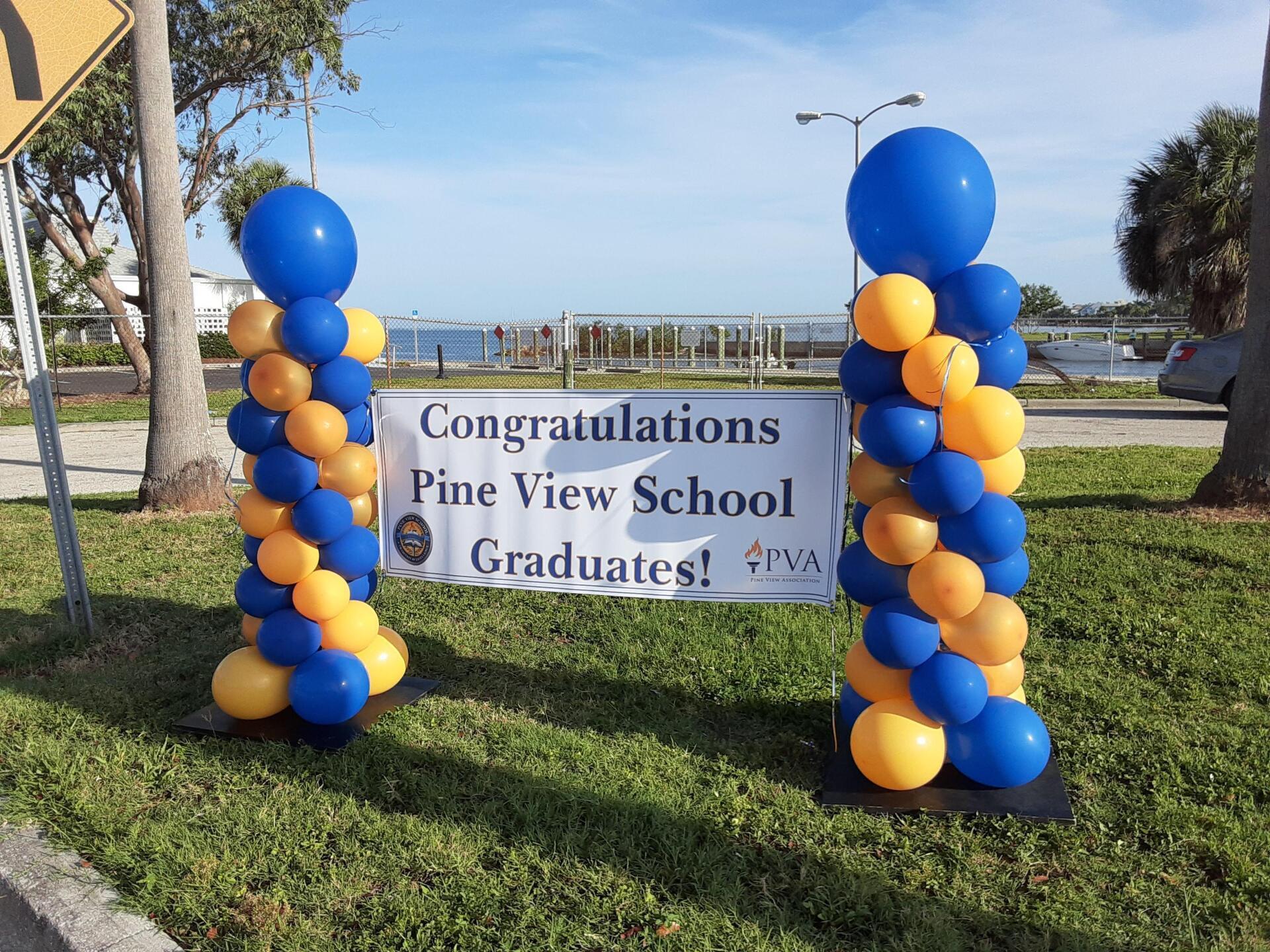 A sign that says congratulations pine view school graduates