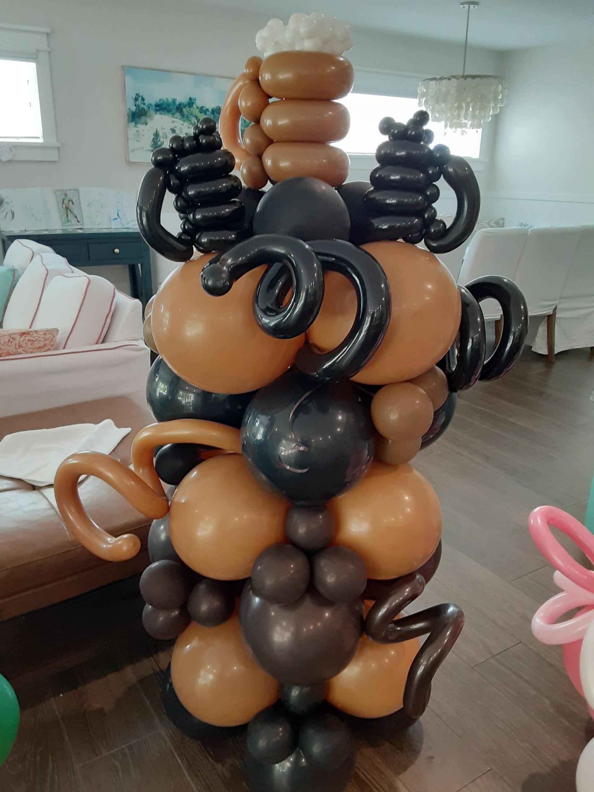A bunch of balloons are stacked on top of each other in a living room.