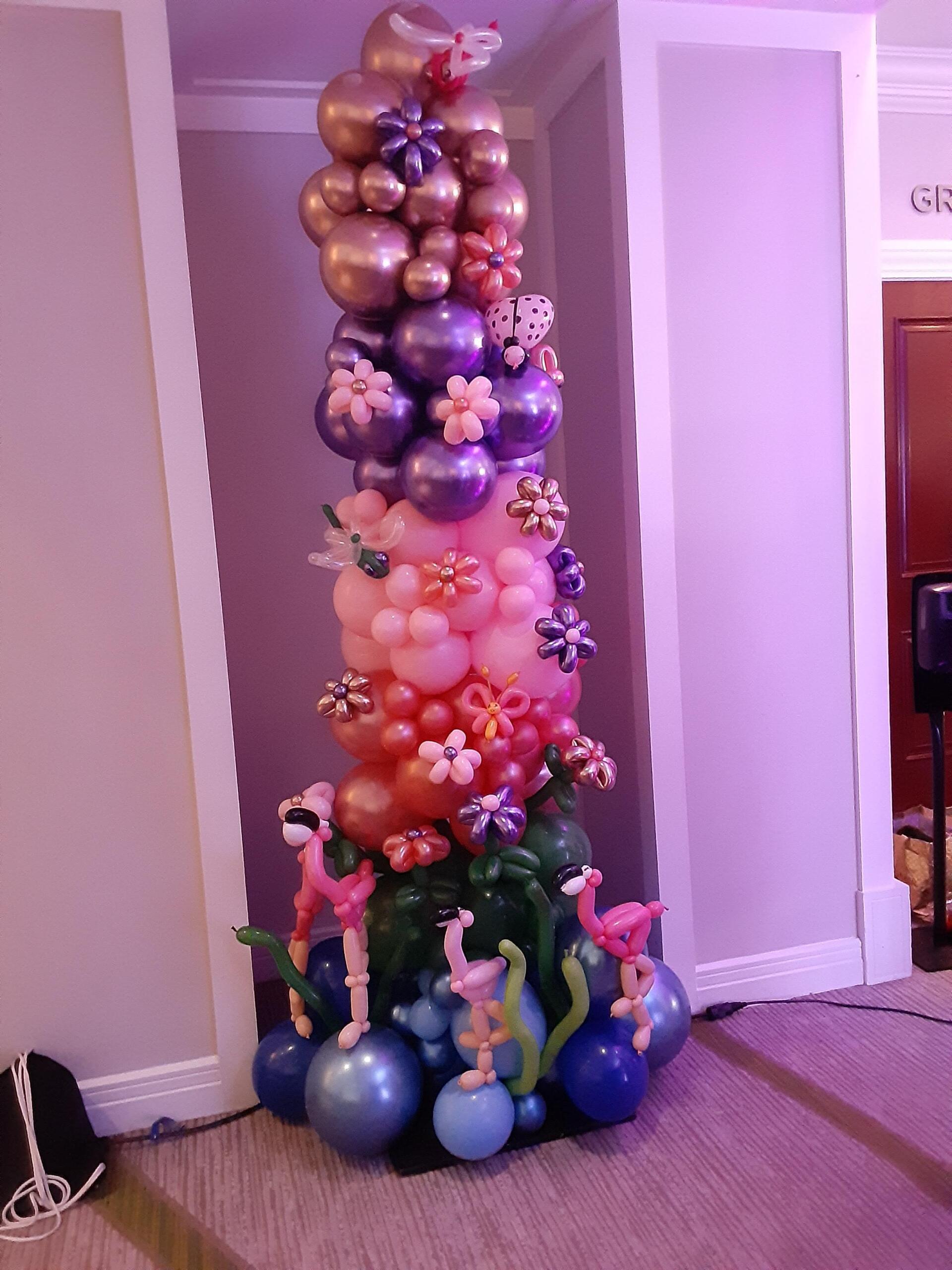 A christmas tree made of balloons in a room